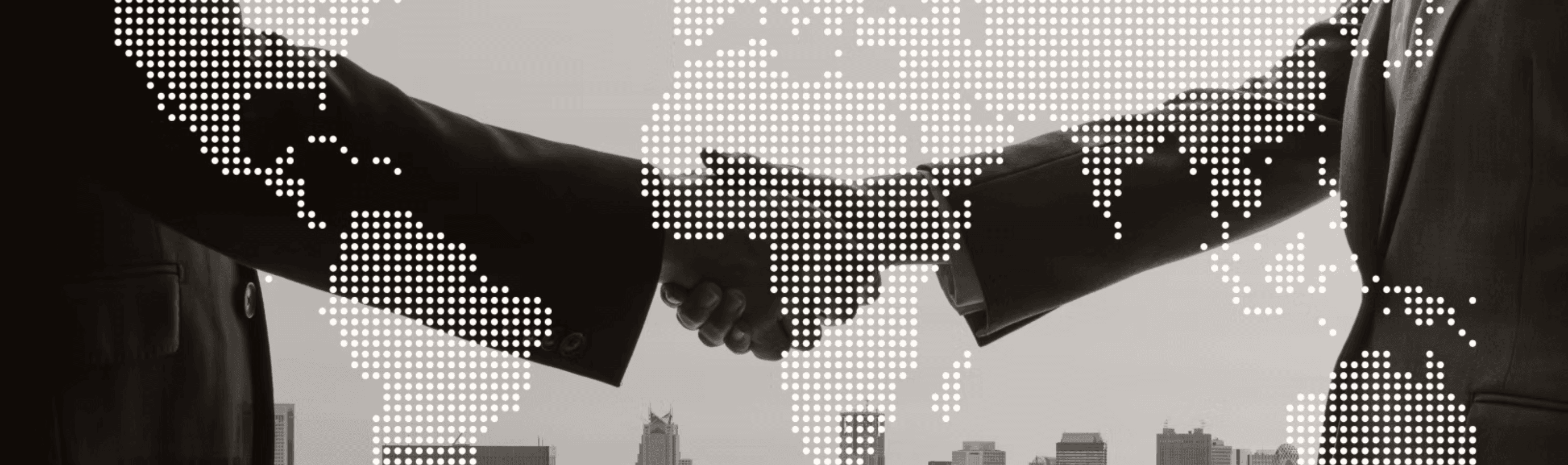 Global business partnership represented by a handshake with world map overlay